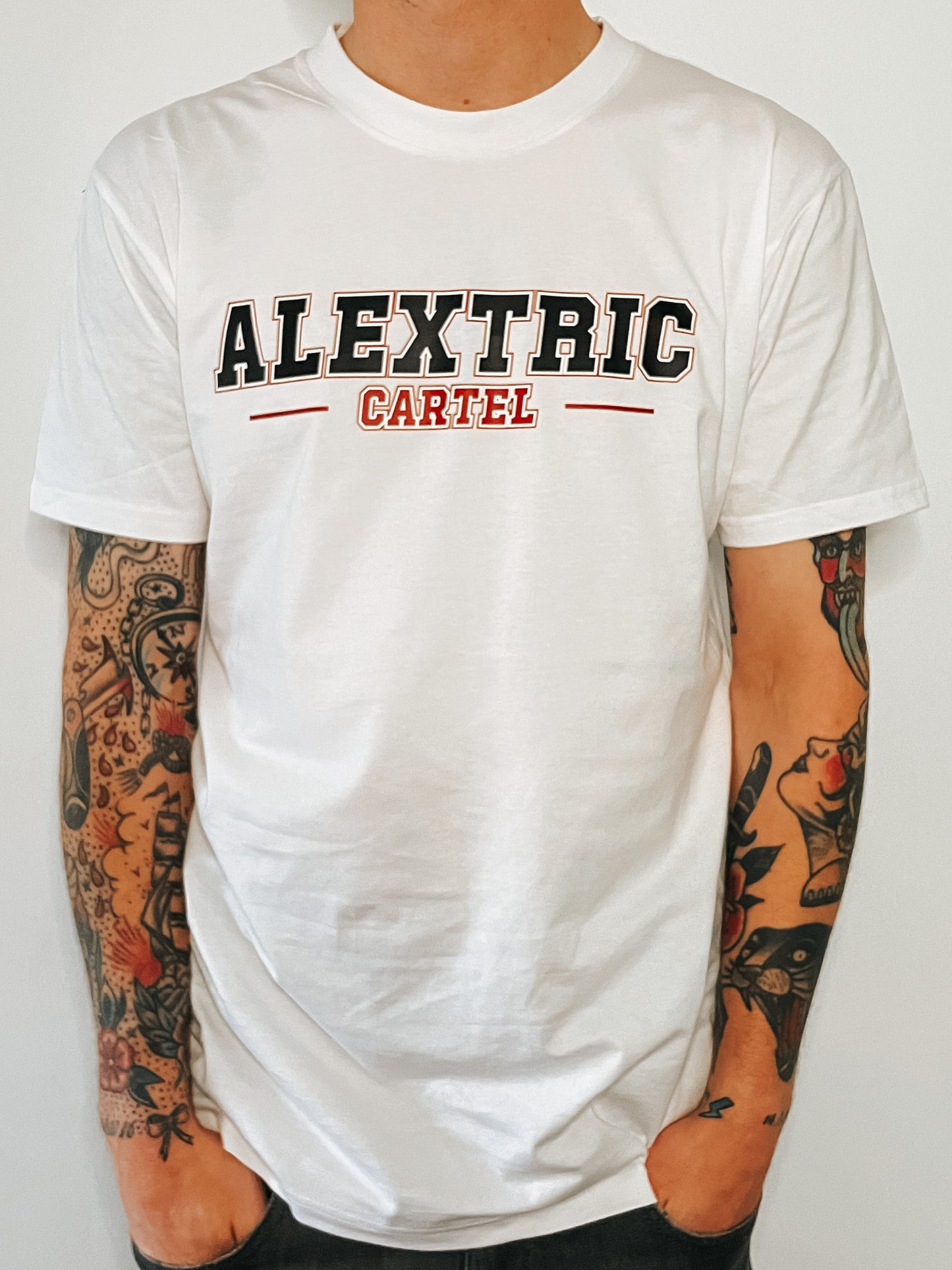 White crew neck tee, with black and red writing. Alextric Cartel