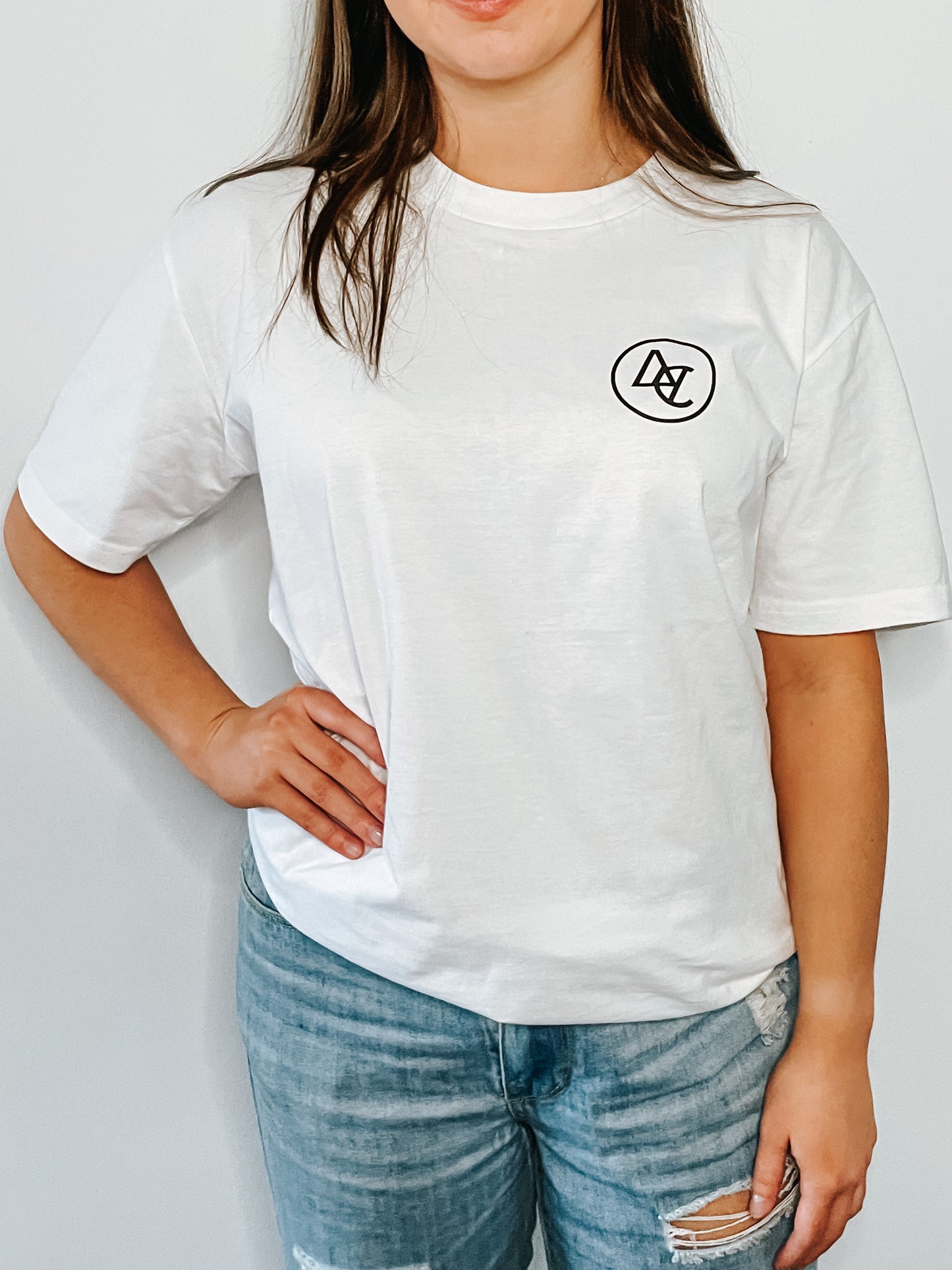 White premium t-shirt with Alextric Cartel logo design on left of chest