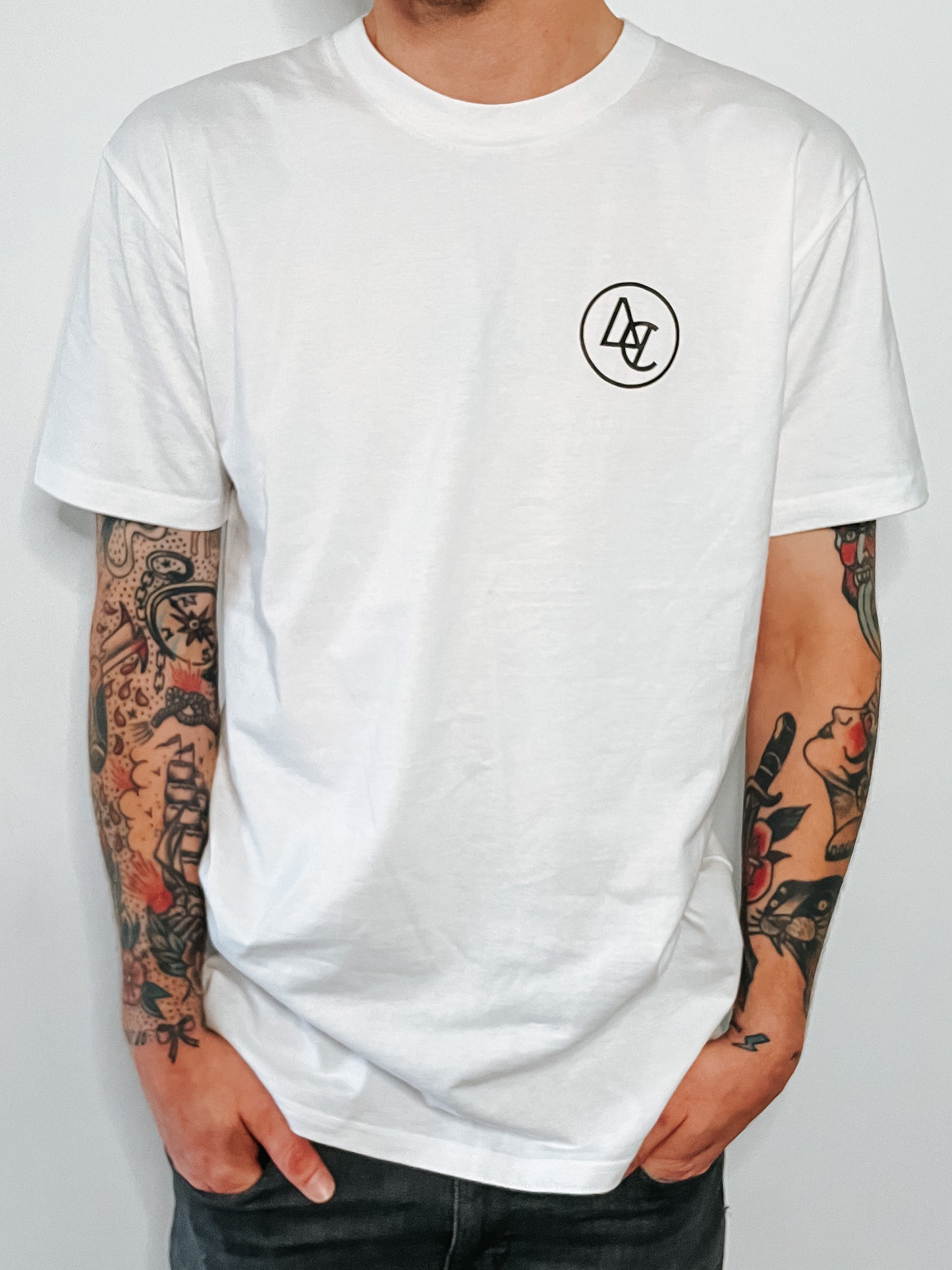 White premium t-shirt with Alextric Cartel logo design on left of chest